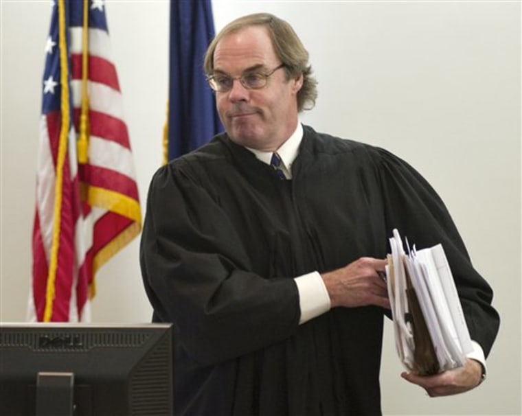 Ketchikan Superior Court Judge William Carey gathers his documents after hearing arguments from attorneys representing the state of Alaska, Joe Miller and Sen. Lisa Murkowski on Wednesday.